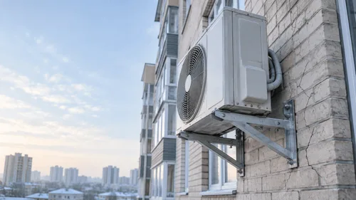 Who is liable for an air conditioner on a facade — and why an HOA chair is on trial for it